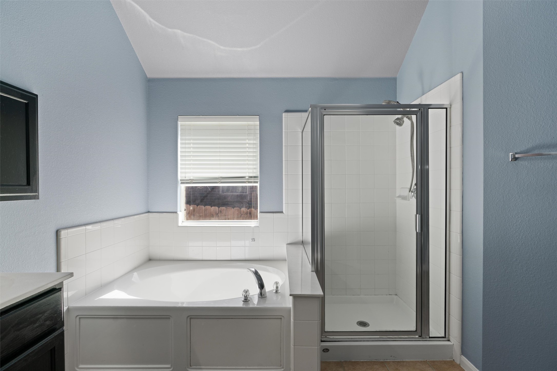 407 Red Hawk Drive Leander, TX 78641 - Photo 20 of 34 a bathroom with a bathtub and a window