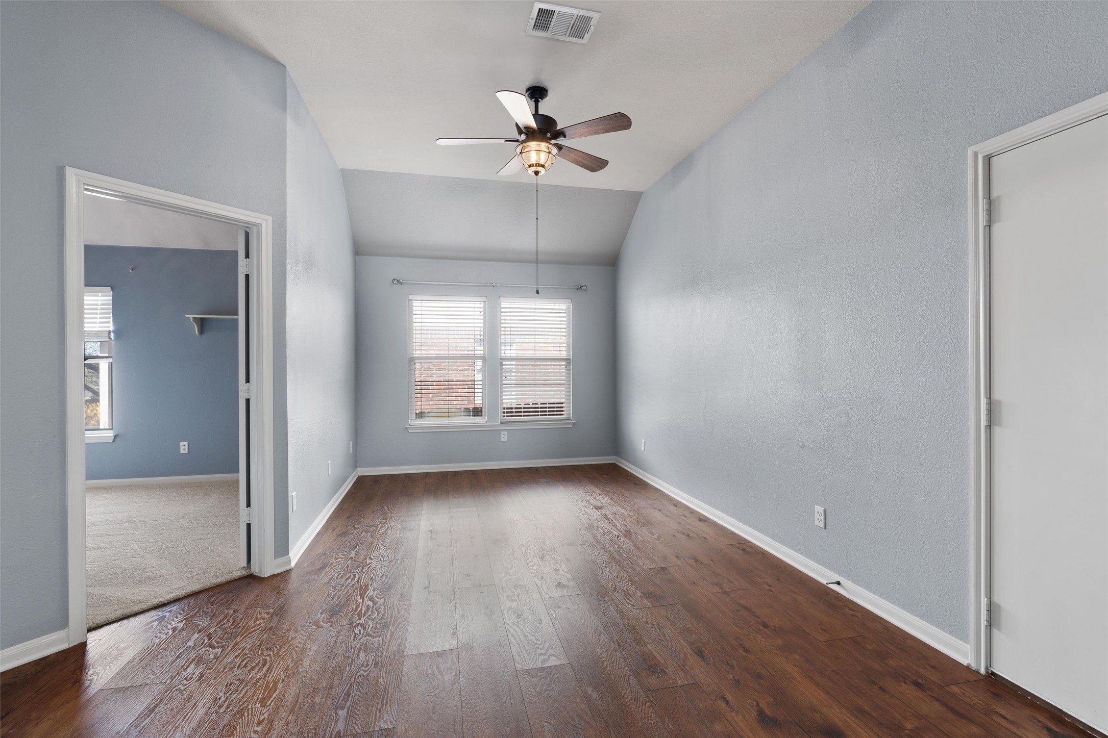 407 Red Hawk Drive Leander, TX 78641 - Photo 22 of 34 wooden floor in an empty room with a window