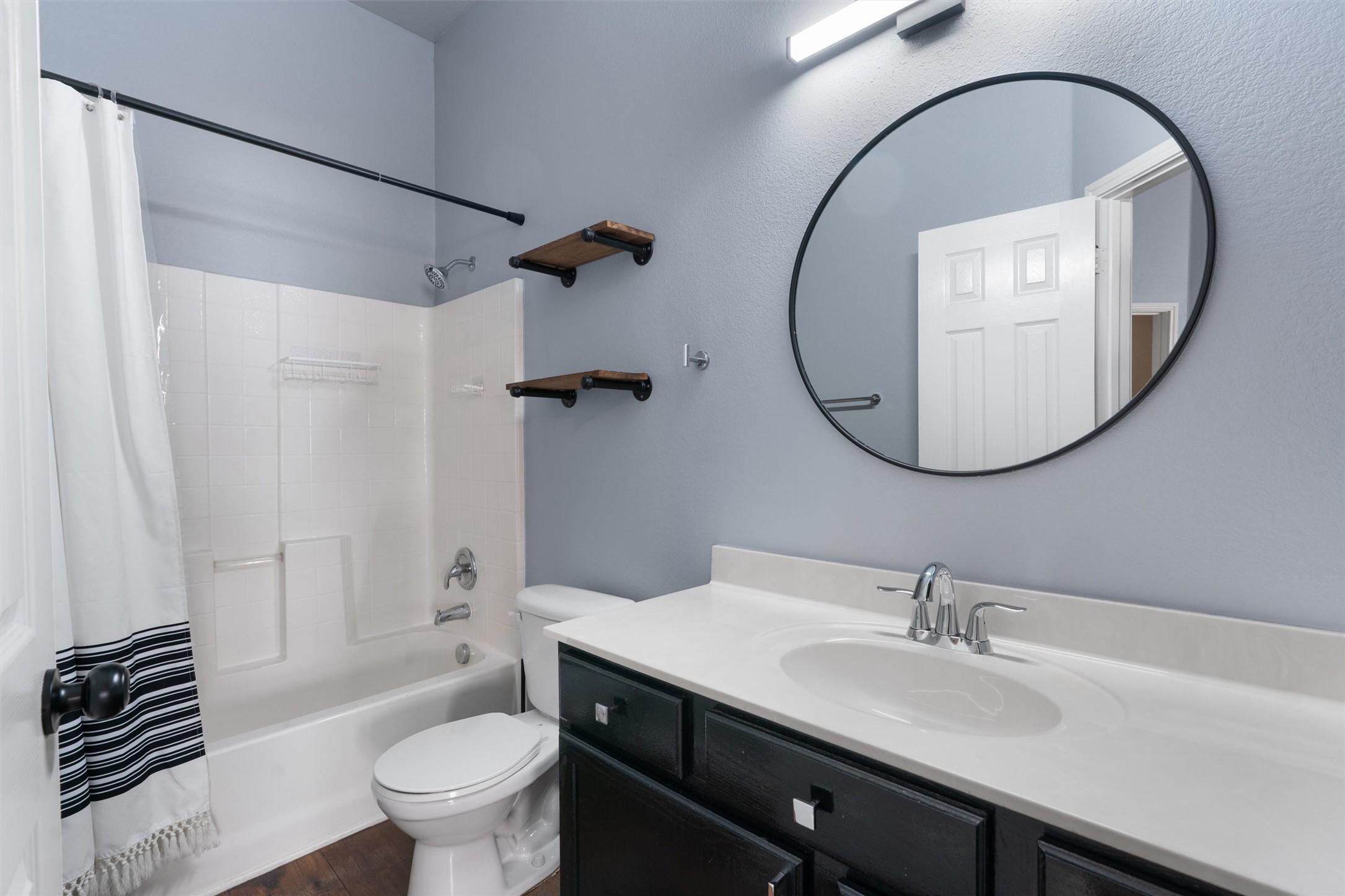407 Red Hawk Drive Leander, TX 78641 - Photo 24 of 34 a bathroom with a sink and a mirror