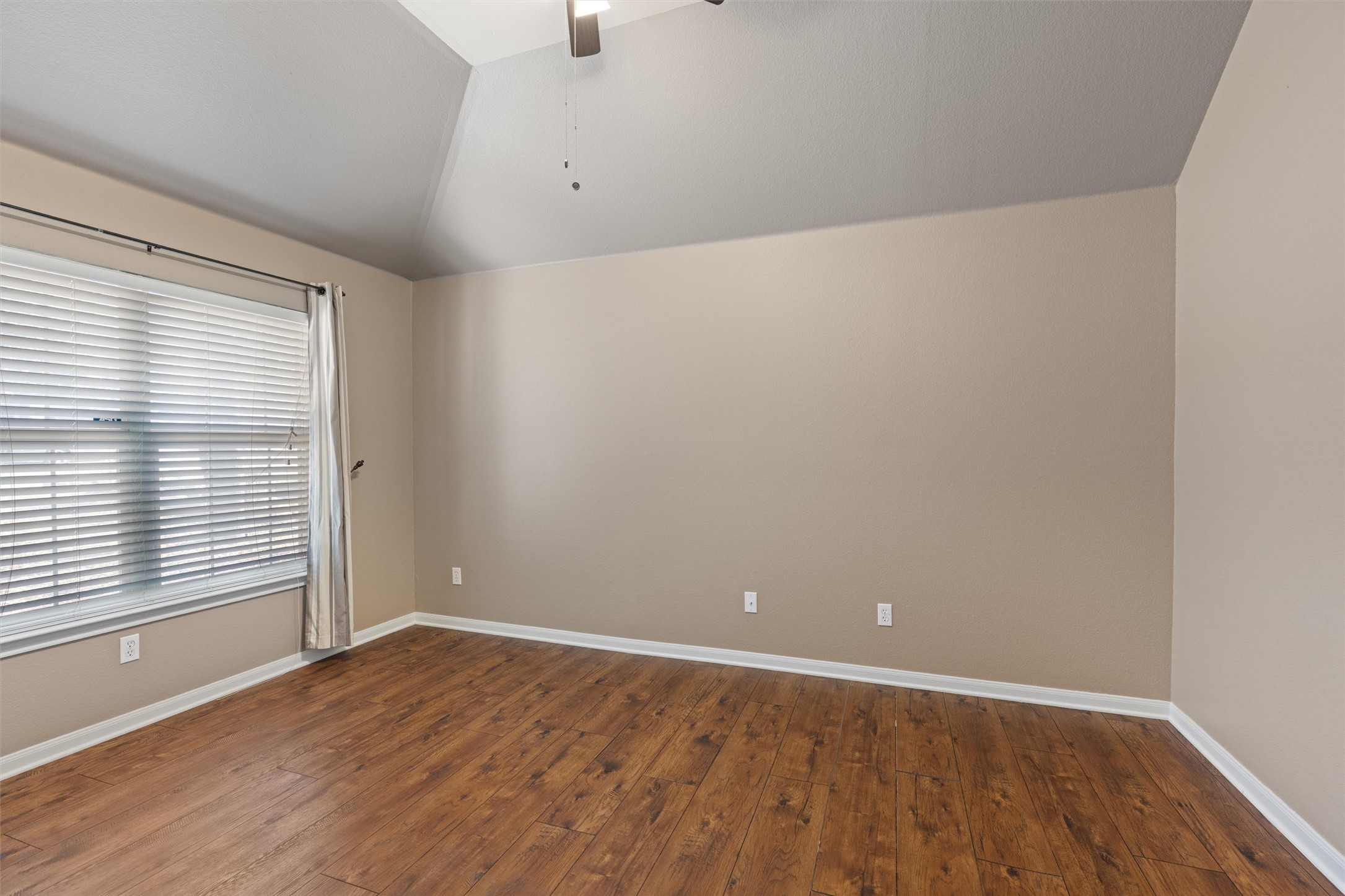 407 Red Hawk Drive Leander, TX 78641 - Photo 4 of 34 an empty room with wooden floor and windows