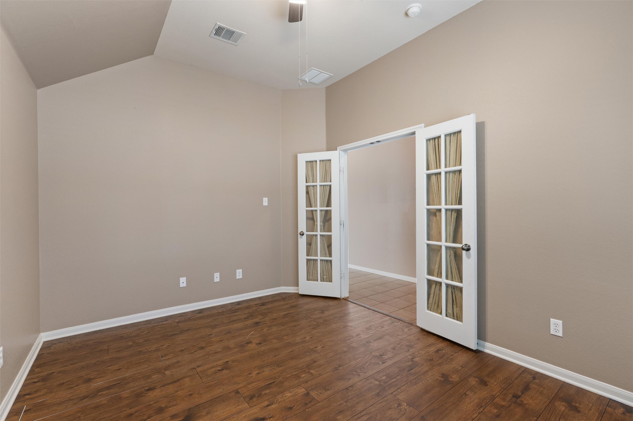 407 Red Hawk Drive Leander, TX 78641 - Photo 5 of 34 a view of an empty room with wooden floor and a window