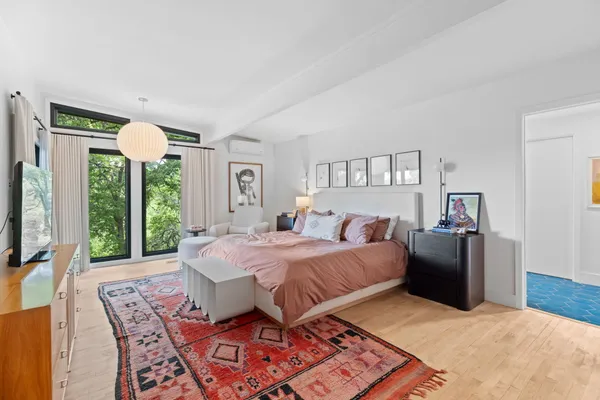 a bed room with a bed and a television