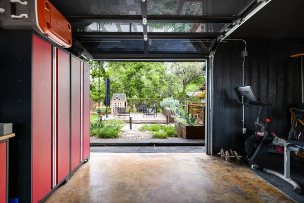 a view of a house with a tree back yard