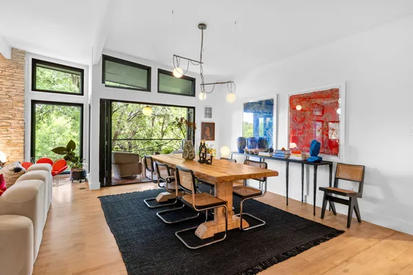 a view of a dining room with furniture window and outside view
