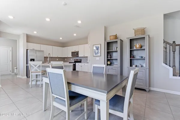 a view of a dining room and livingroom with furniture
