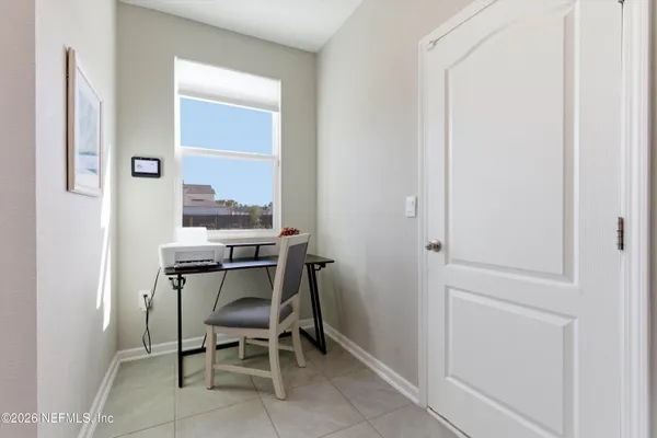 a dining room with furniture and window