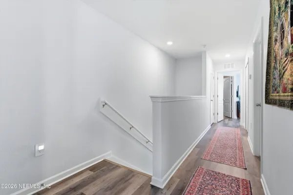a view of entryway with wooden floor