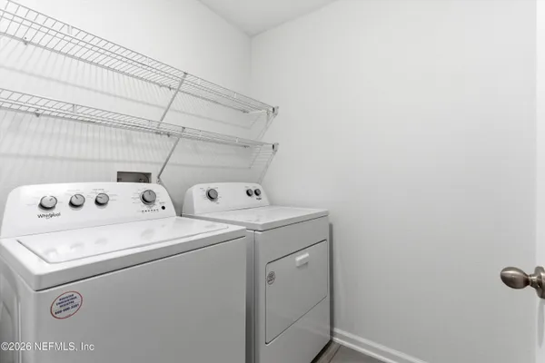 a utility room with dryer and washer