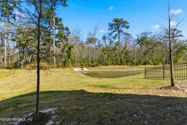 a view of a yard with swimming pool