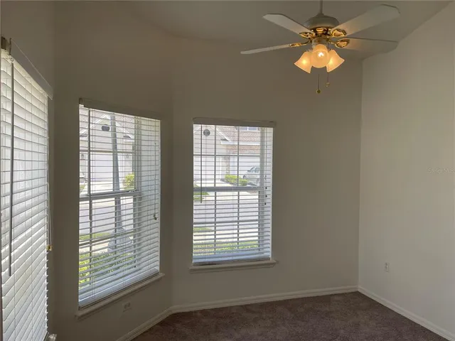 a view of empty room with windows