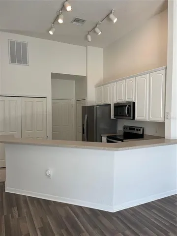 a view of a kitchen with electric equipment