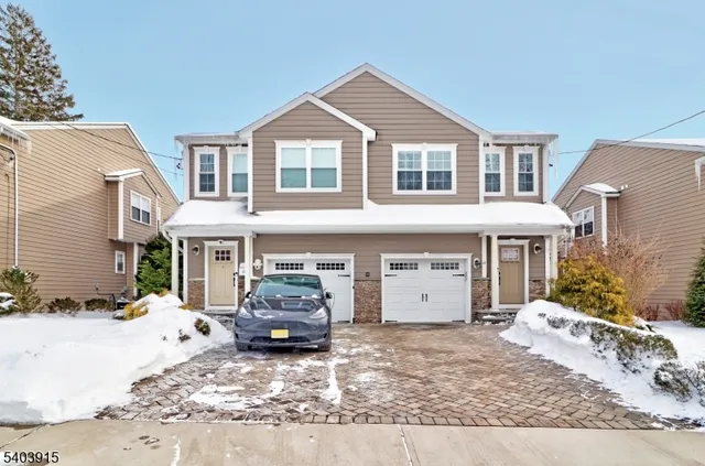 a view of a white house with a outdoor space