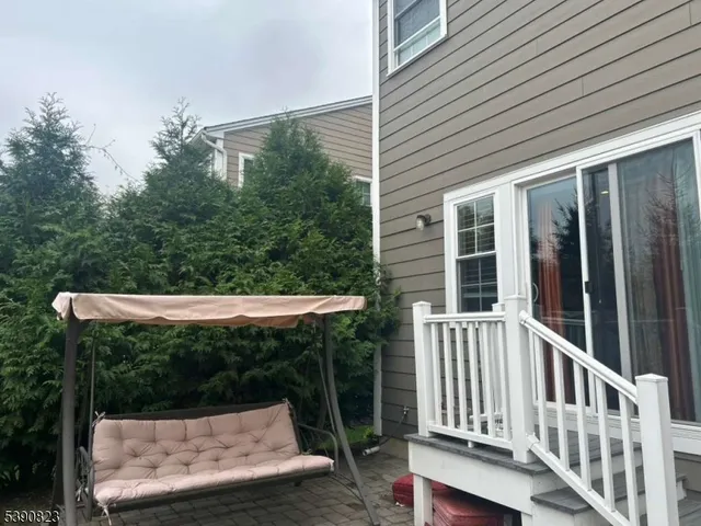 a view of a chair and table in the balcony