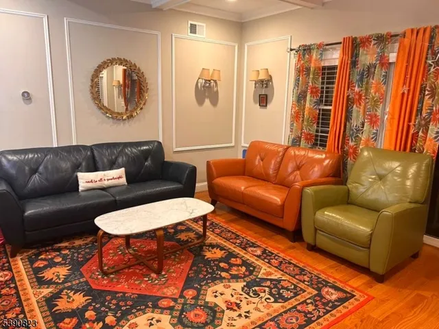 a living room with furniture and a rug