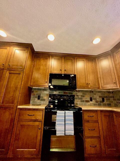 New Cabinets, Backsplash and Recessed Lighting.