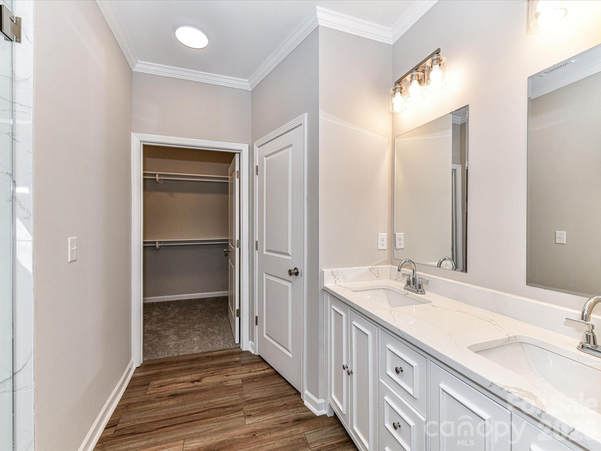104 Poplar Street Clover, SC 29710 - Photo 19 of 33 a bathroom with a double vanity sink and a mirror