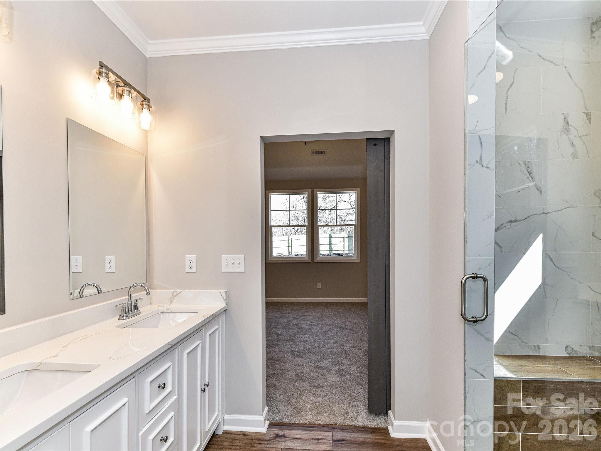 104 Poplar Street Clover, SC 29710 - Photo 22 of 33 a bathroom with a double vanity sink and mirror