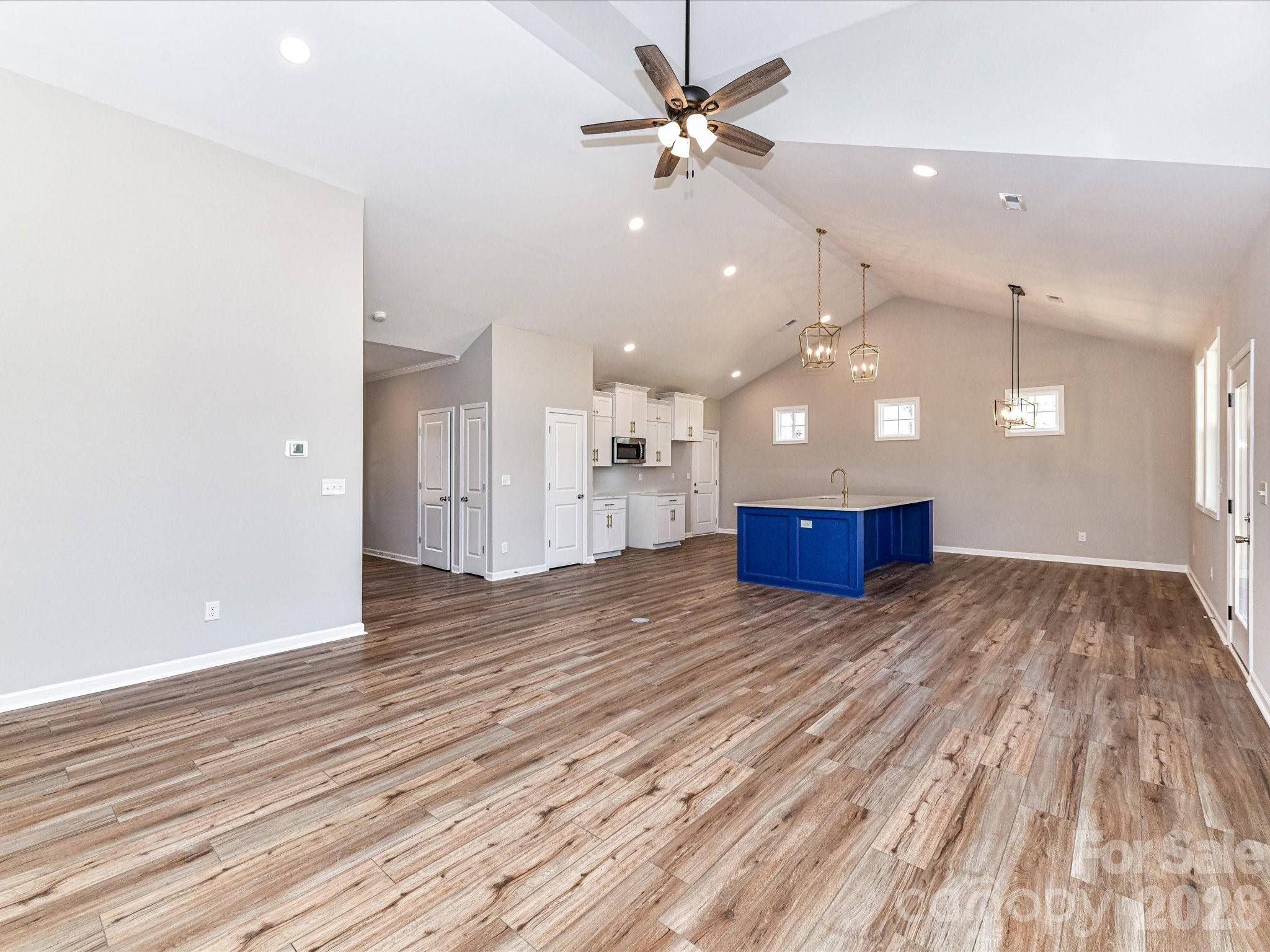 104 Poplar Street Clover, SC 29710 - Photo 8 of 33 a view of kitchen and hall with wooden floor