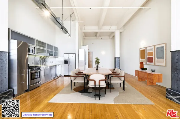 a living room with furniture a rug and a table