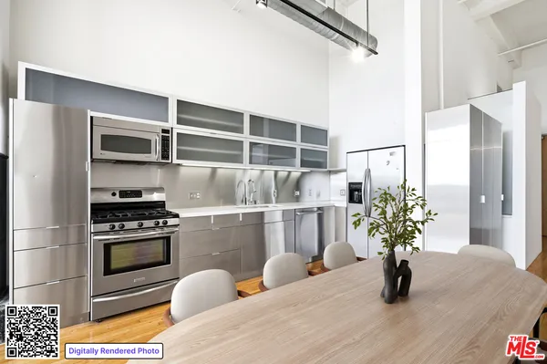 a kitchen with a refrigerator and a potted plant