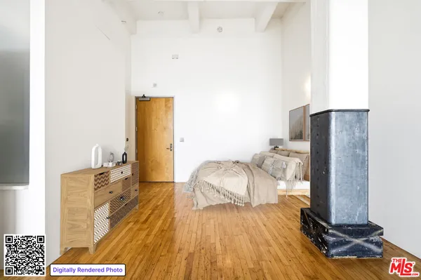 a view of a room with wooden floor
