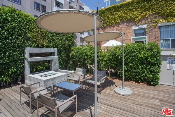 swimming pool with outdoor seating and yard