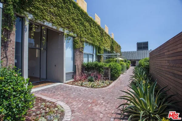 a view of a building with a yard