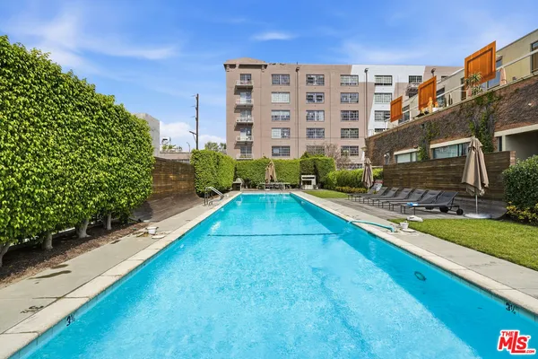 a view of a swimming pool with a chairs