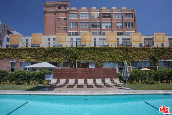 a view of a swimming pool with a lounge chairs