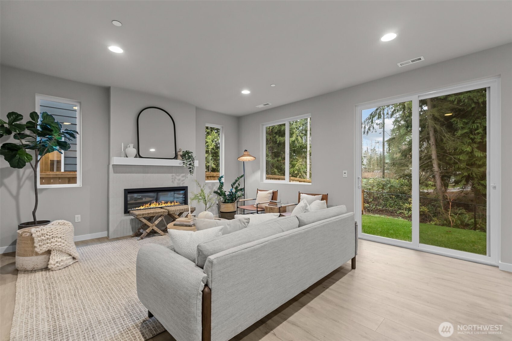 122 169th Place Southwest, Unit A Bothell, WA 98012 - Photo 12 of 29 a living room with furniture and a fireplace