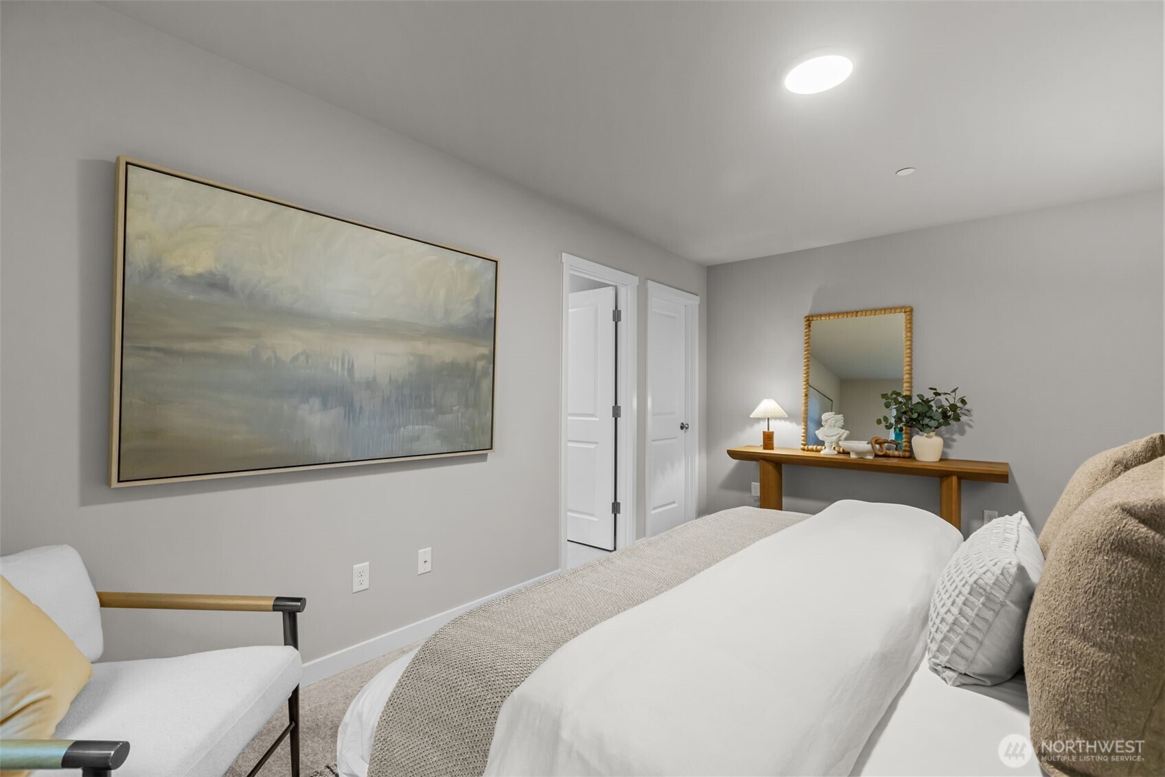 122 169th Place Southwest, Unit A Bothell, WA 98012 - Photo 14 of 29 a bedroom with a bed and a flat screen tv