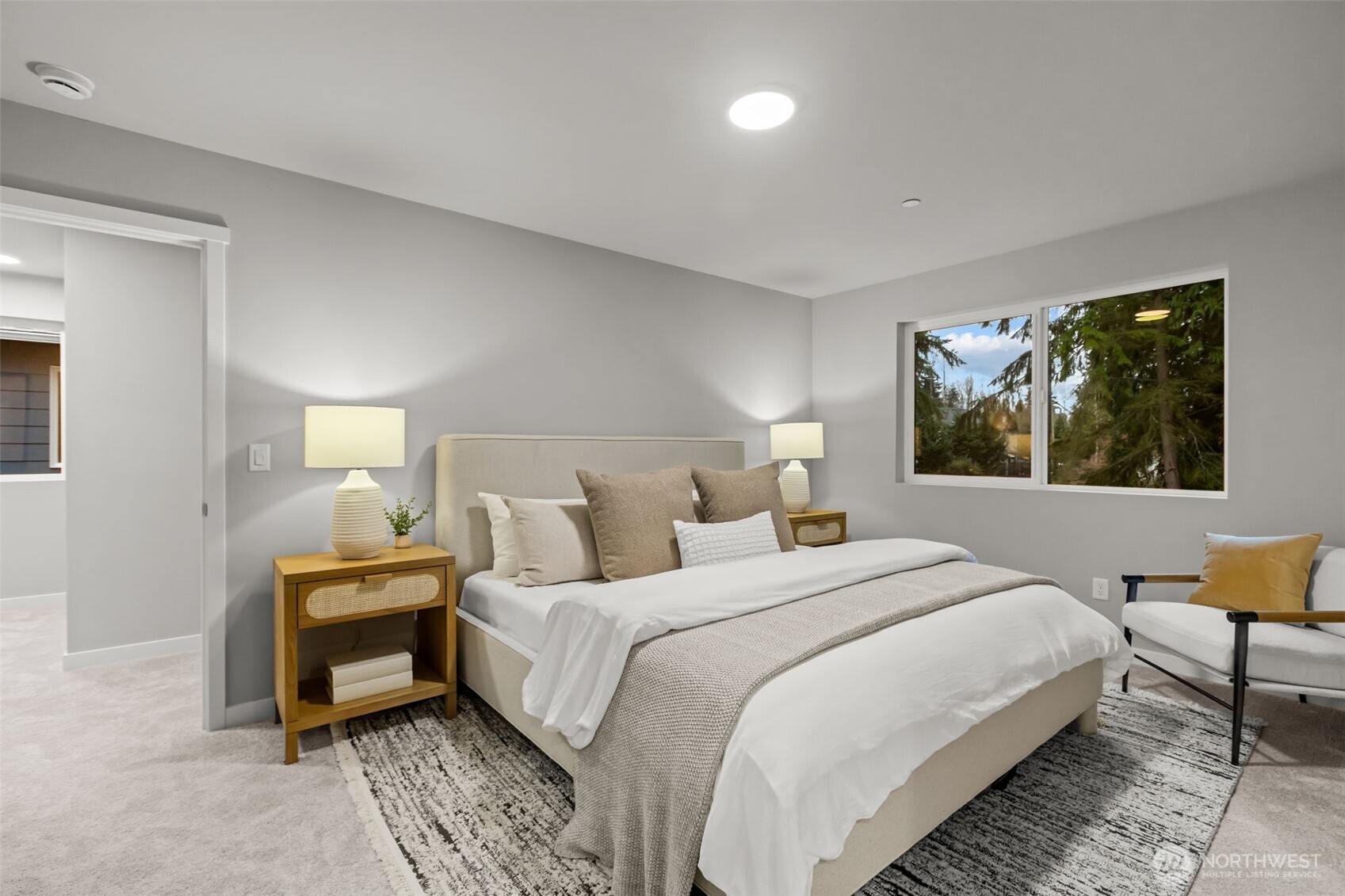 122 169th Place Southwest, Unit A Bothell, WA 98012 - Photo 17 of 29 a bedroom with a bed and wooden floor