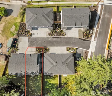 an aerial view of houses with outdoor space