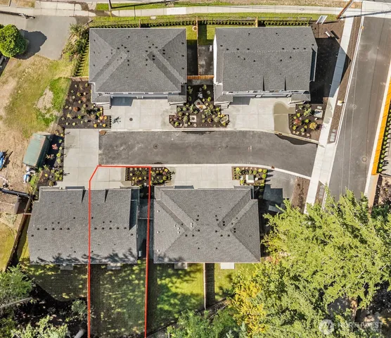 an aerial view of houses with outdoor space