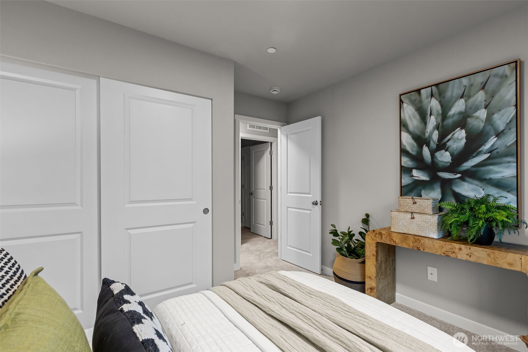 122 169th Place Southwest, Unit A Bothell, WA 98012 - Photo 25 of 29 a bedroom with a bed and a potted plant