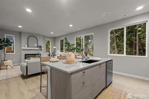 a kitchen that has a table and chairs in it
