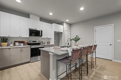 a living room with furniture kitchen and kitchen view