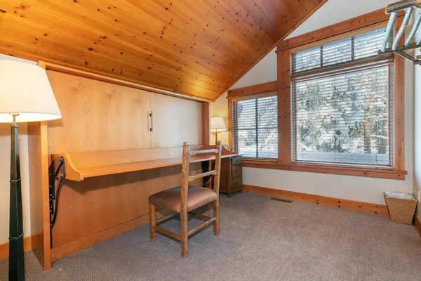 a living room with furniture window and a fireplace