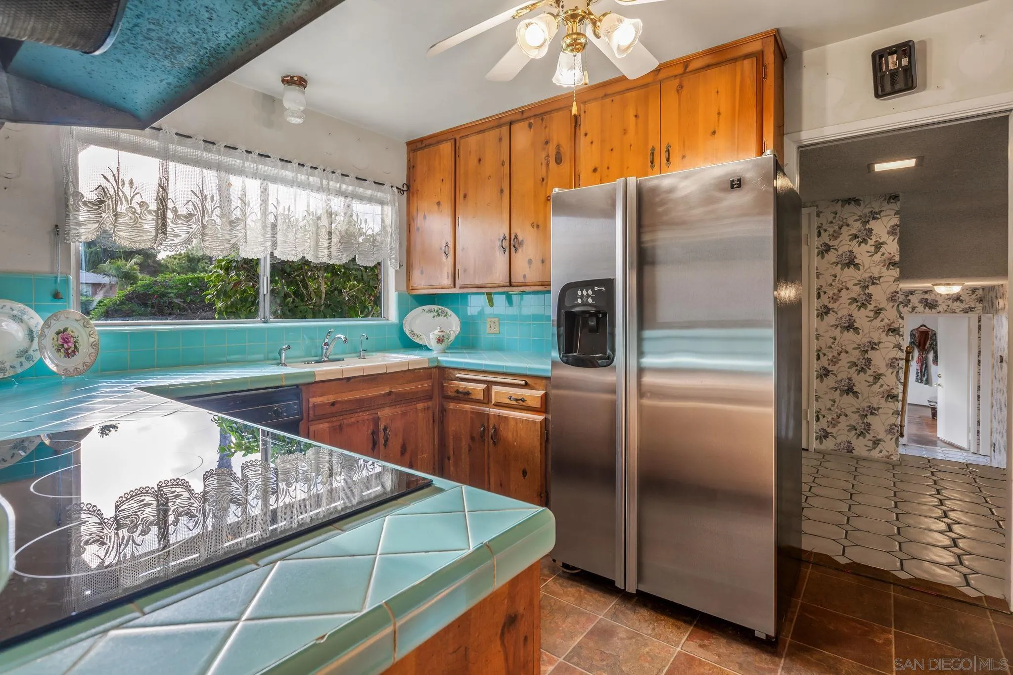 5645 Severin Drive La Mesa, CA 91942 - Photo 14 of 29 a kitchen with stainless steel appliances granite countertop a refrigerator a sink and a stove