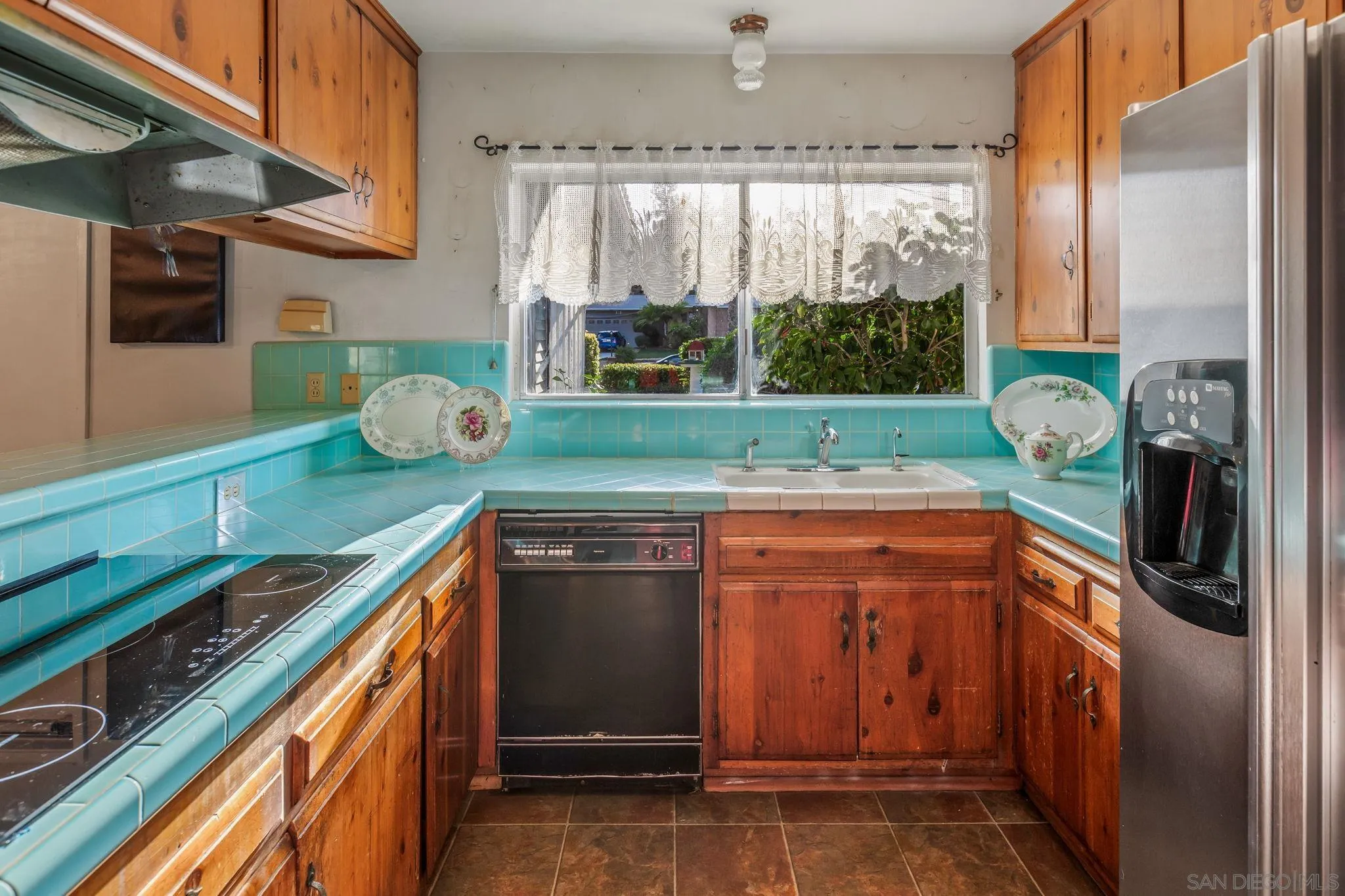 5645 Severin Drive La Mesa, CA 91942 - Photo 15 of 29 a kitchen with granite countertop a stove and a sink
