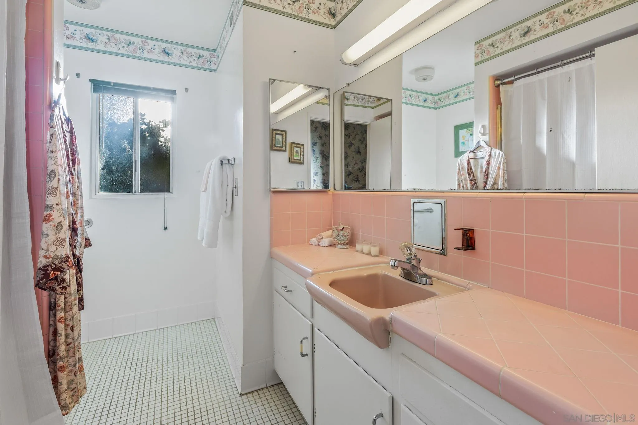5645 Severin Drive La Mesa, CA 91942 - Photo 19 of 29 a bathroom with a sink and mirror