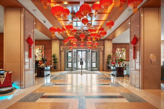 a living room with fireplace furniture and a flat screen tv
