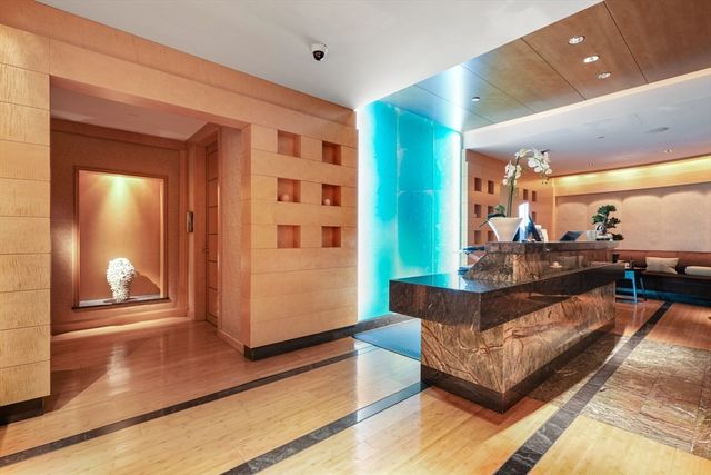 a living room with furniture a dining table and a large window