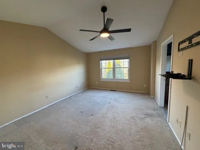 a view of empty room with windows