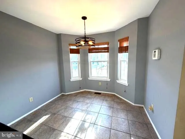 a view of an empty room with windows