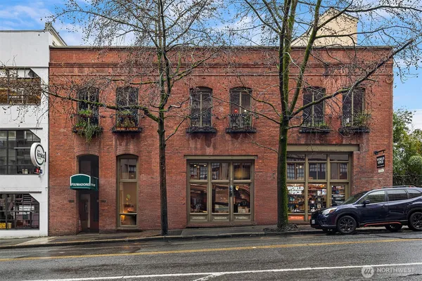 a view of a building and a people on a street