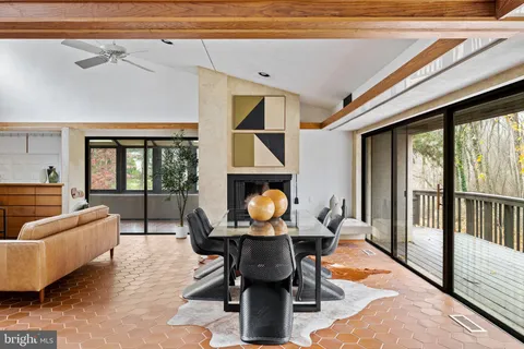 a bedroom with furniture and a large window