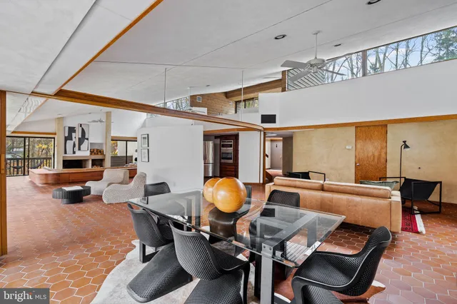 a living room with furniture fireplace and flat screen tv