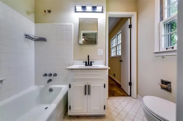a bathroom with a sink a toilet and a bathtub