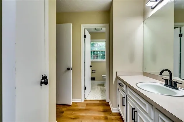 a bathroom with a sink and mirror